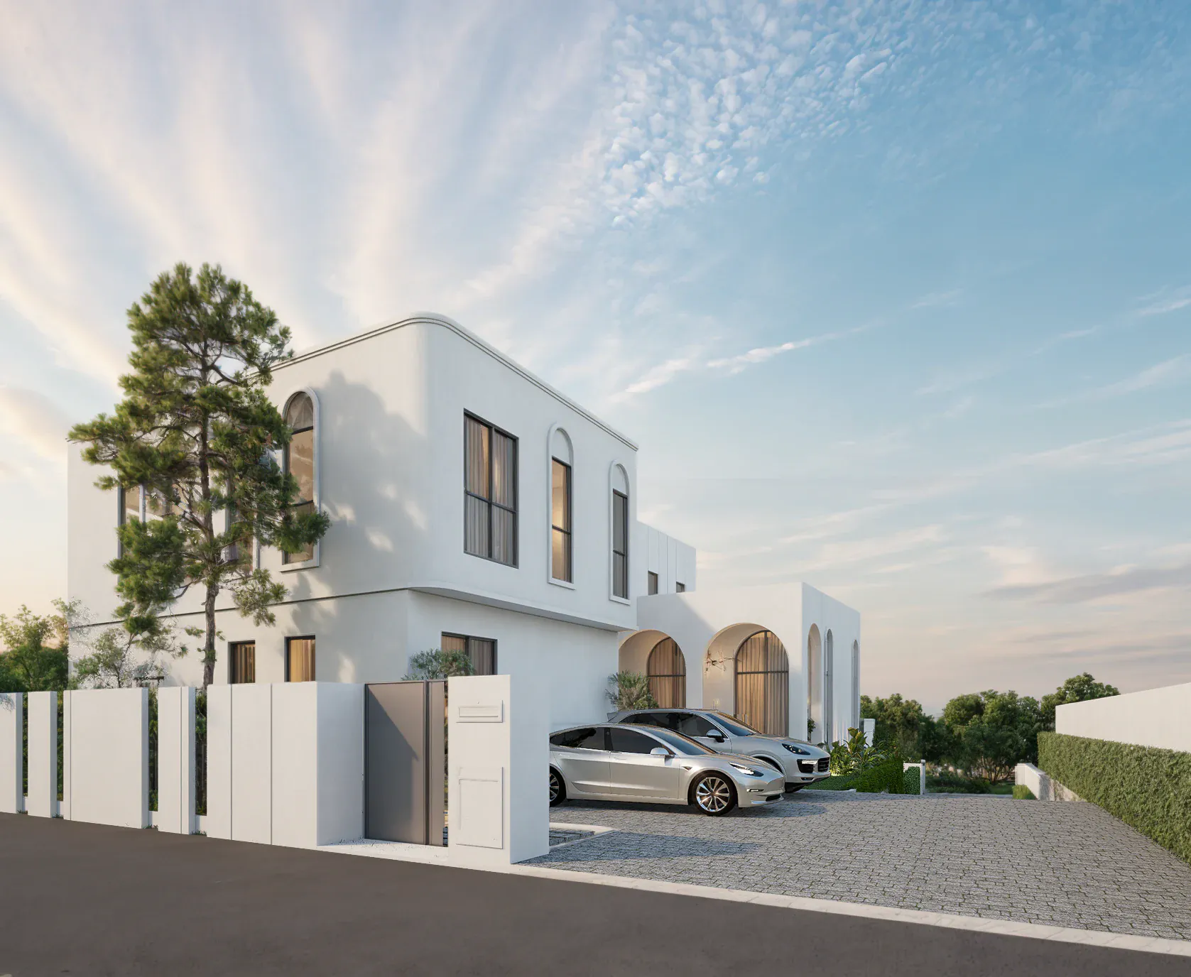 Street-side arrival view of Ban Nuea, showing the two-storey main residence, entrance gate, boundary walls, planting, and parked cars.