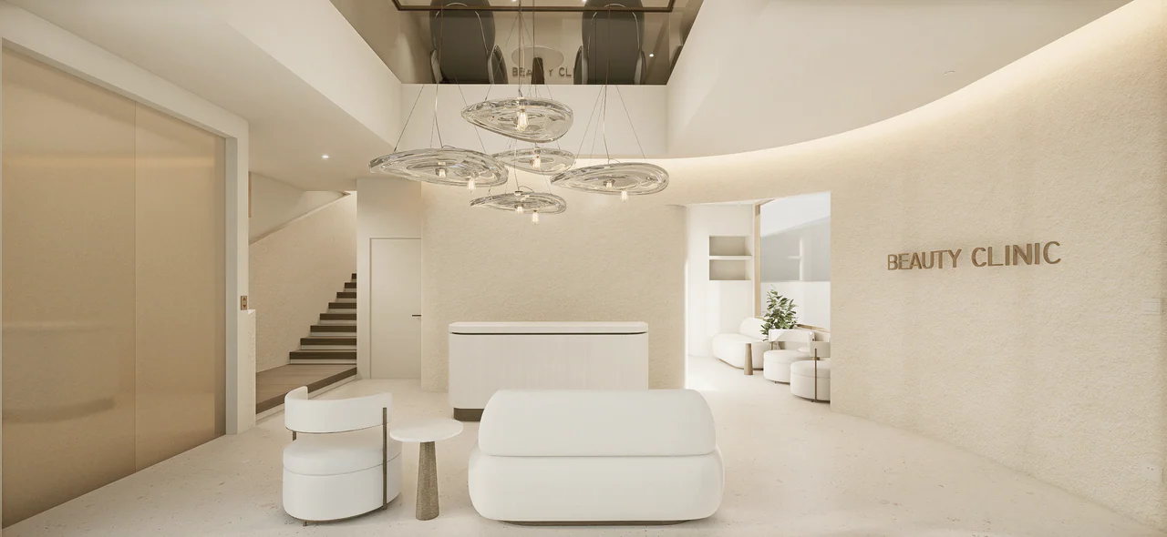 Design visualisation of the lobby, showing the reception counter, stairs and curved wall around the waiting area.
