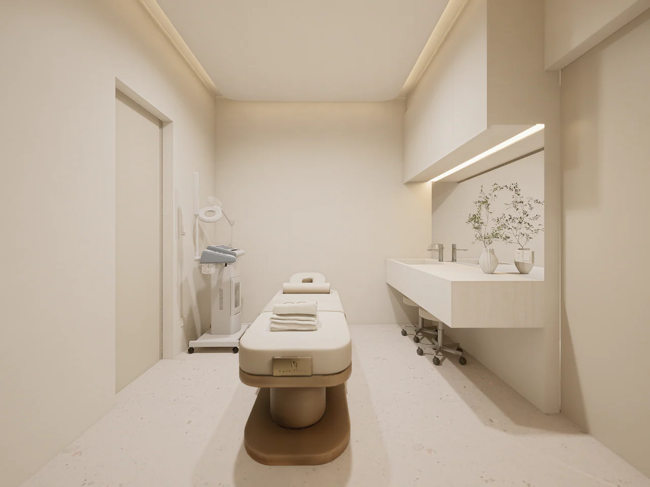 Design visualisation looking along a treatment bed towards the room’s worktop and fitted storage.