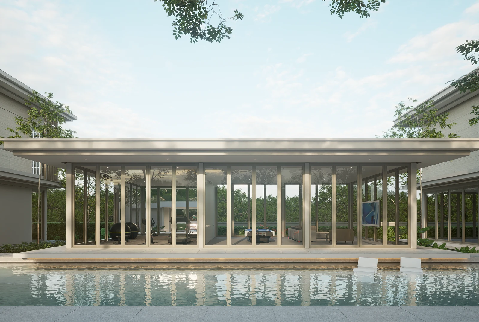 Front view of the glazed single-storey clubhouse beside the pool at BANG BUA THONG.
