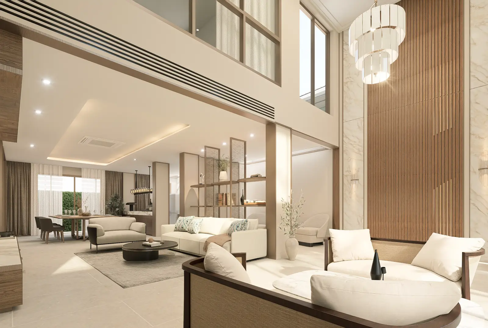 Diagonal view from the double-height hall toward a lower-ceiling sitting area.