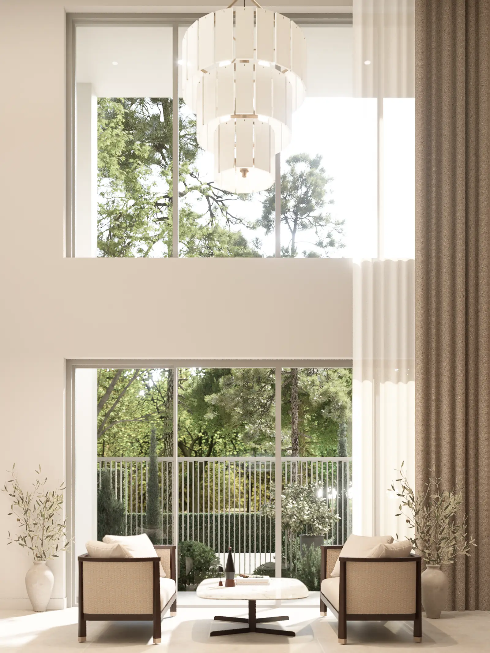 Portrait view toward the tall front glazing with a chandelier and two dark-framed chairs.